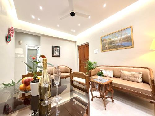 a living room with a couch and a table at Luxury Stays By The Beach Goa in Benaulim