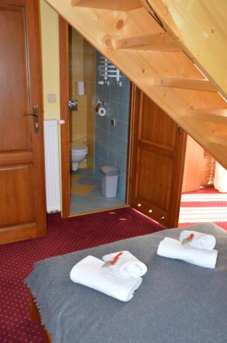 Ένα ή περισσότερα κρεβάτια σε δωμάτιο στο Willa Trybszanka