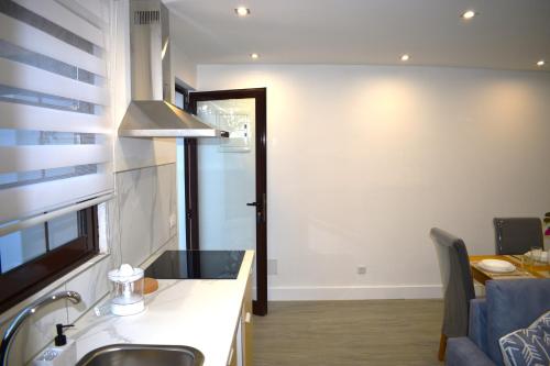 a kitchen with a sink and a counter top at Apartamento Casa Leo in Playa Blanca