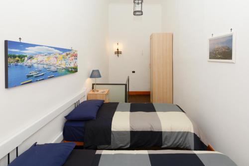 Posteľ alebo postele v izbe v ubytovaní Residenza Santa Chiara