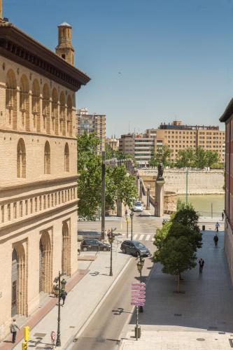a view of a street in a city with buildings at Hotel Tibur in Zaragoza