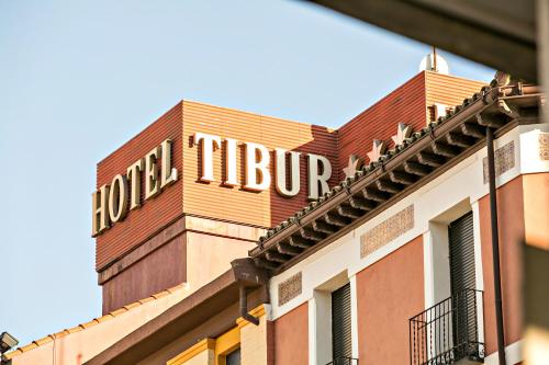 a building with a sign on the top of it at Hotel Tibur in Zaragoza