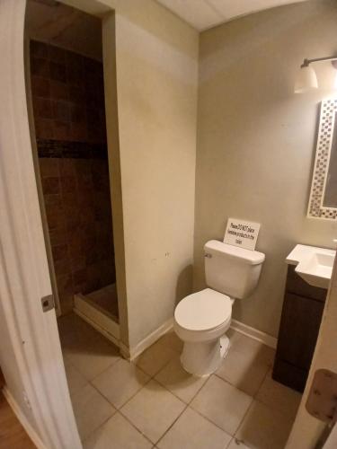 a bathroom with a toilet and a shower at Rasta House Fantasy in Lithia Springs