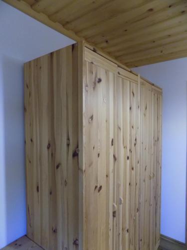 a wooden wall in a room with a ceiling at Apartment Zeleni dragulj Pohorje in Oplotnica