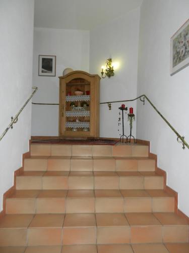 a set of stairs with a fireplace in a room at Appartementhaus zum Holzknecht am See in Neustift im Stubaital