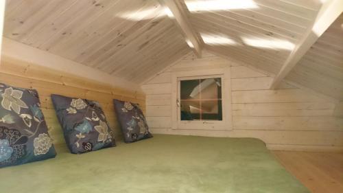 a small room with a bed in a cabin at Stora Sandfell Rooms and Cottages in Stóra-Sandfell