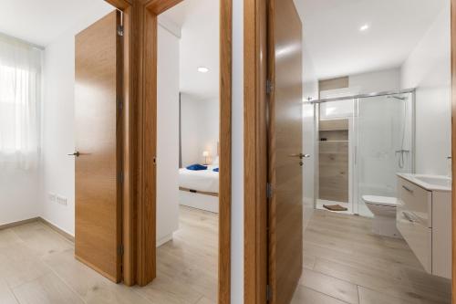 a bathroom with a shower and a toilet at Merlin 14 V1 in Playa Honda