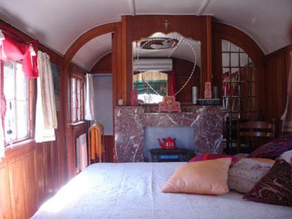 a bedroom with a large bed in a room at L'Amandari - Chambres d'hôtes in Plan-de-la-Tour