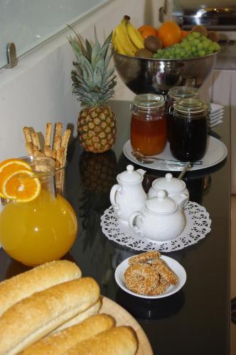 a table with various types of bread and fruit at Hotel Astron Princess in Karpathos Town