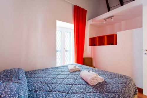 Säng eller sängar i ett rum på Casa Professa Luxury Palermo Center