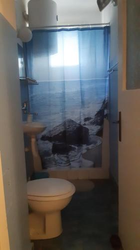a bathroom with a toilet and a sink at Georgina in Rospi Ćuprija