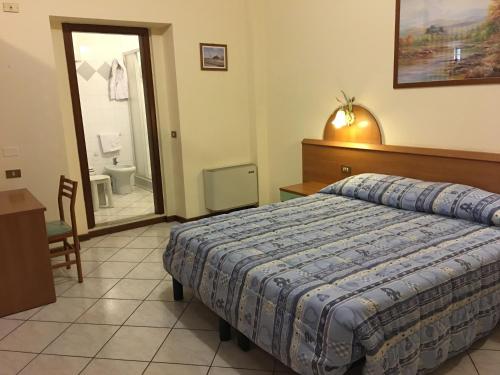 Ένα ή περισσότερα κρεβάτια σε δωμάτιο στο Residence Isabella