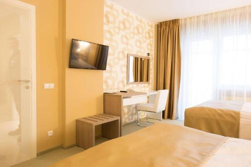 Postel nebo postele na pokoji v ubytování Bruxelles Guesthouse Craiova
