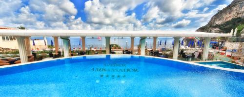 a large blue swimming pool on top of a building at Hotel Weber Ambassador in Capri