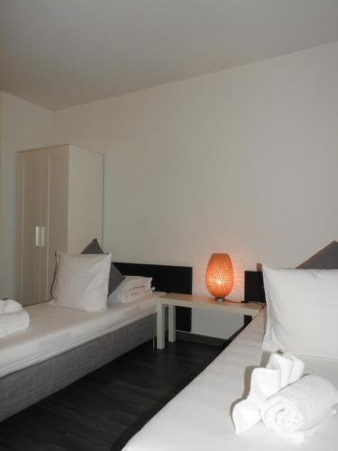 Ένα ή περισσότερα κρεβάτια σε δωμάτιο στο INSIDE FIVE - City Apartments
