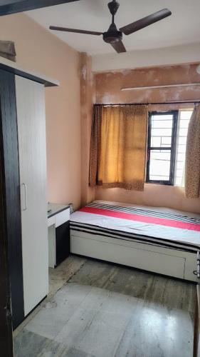 a bedroom with a large bed in a room at Gem Backpackers hostel in Siliguri
