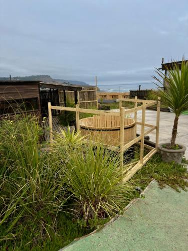 a wooden fence on the beach with the ocean in the background at Casa al mare due - Matanzas y Pupuya in Navidad