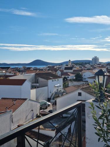 a view of a city from the roof of a building at Lion Apartments in Vodice