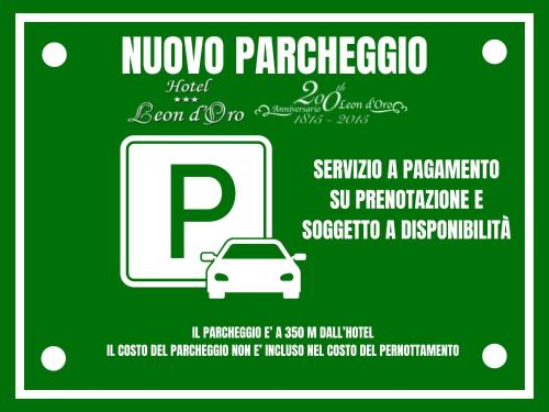 a poster of a car in front of a cell phone at Hotel Leon D'Oro in Orta San Giulio