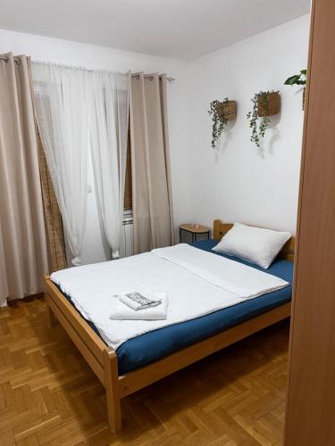 a bedroom with a bed in a room at Barbello in Stara Pazova
