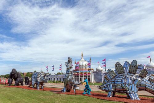 a group ofulptures of elephants in front of a building at Deluxe Inn Denton in Denton