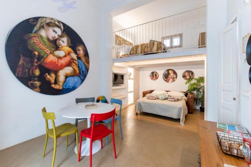 a room with a table and chairs and a bedroom at Suite Diffuse - Widespread Suite Collection PCB LUXURY in Ostuni