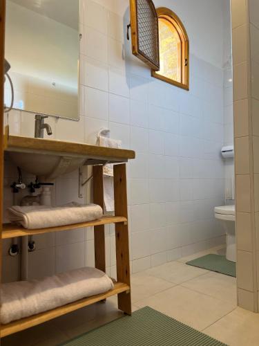 a bathroom with a sink and a mirror at Villa Sun and Chill, Ferme d'hôtes familiale avec piscine animée, restaurant et jardin près de Safi in Safi
