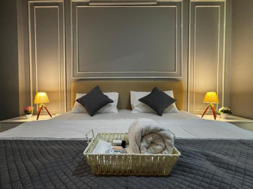 a bedroom with a bed with a basket on it at Maison Royale House 3bhk apartment in Jaipur