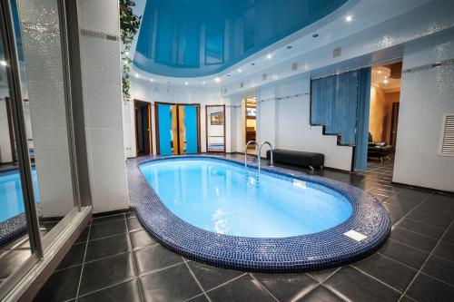 a large swimming pool in a building with at Stariy Rostov Hotel in Rostov on Don