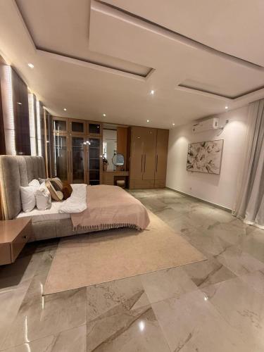 a large bedroom with a large bed in a room at La villa Bella Vista in Somone