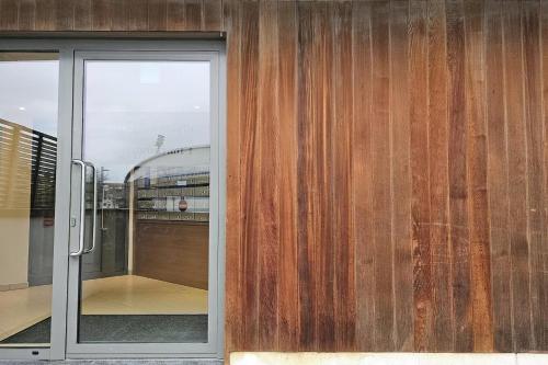 a sliding glass door of a building with a balcony at Christel Residence in Ostend