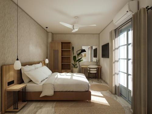 a bedroom with a bed and a window at Inoe Boutique Hotel in Kamari