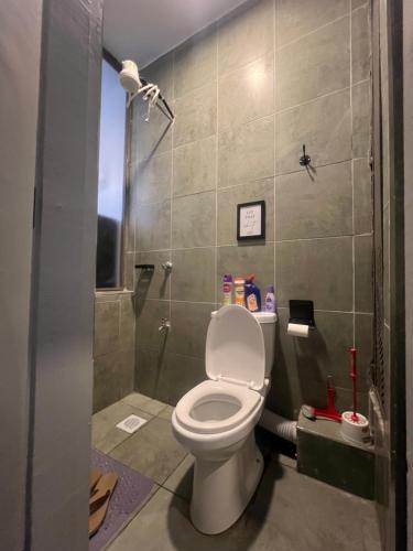a bathroom with a toilet and a shower at Sk home in Kiambu
