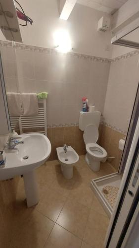a bathroom with a toilet and a sink at Midnight sun pomposa lido in Lido di Pomposa