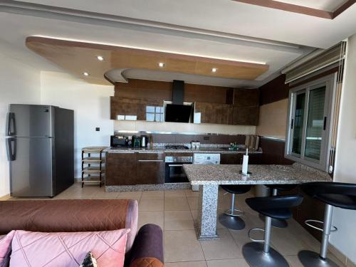 Kuchyň nebo kuchyňský kout v ubytování Fnideq Seaside Apartment
