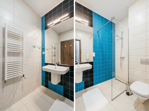 two pictures of a bathroom with a sink and a toilet at Altus Hotel & Spa in Praid