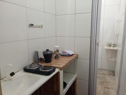 a bathroom with a tub and a sink and a shower at POUSADA GOLFINHO FLECHEIRAS Ce in Trairi