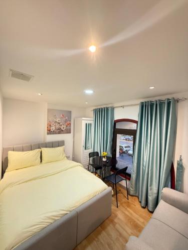 a bedroom with a large bed and a couch at Grand International in Abu Dhabi