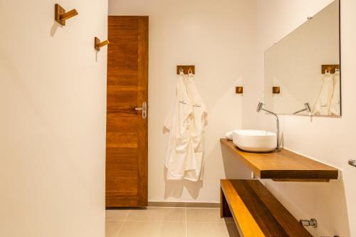 a bathroom with a sink and a mirror at Villa Shamsa - Grupo Messina in Jericoacoara