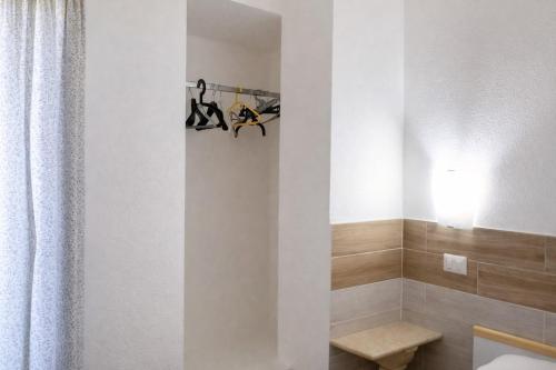 a bathroom with a toilet and a shower curtain at Terrazza sul Mare Case Vacanze in Capo Rizzuto