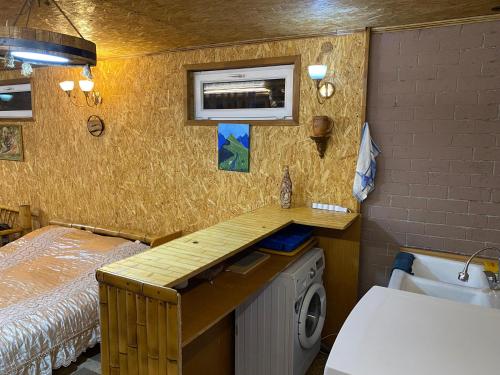 Llit o llits en una habitació de Cottage Bambuk