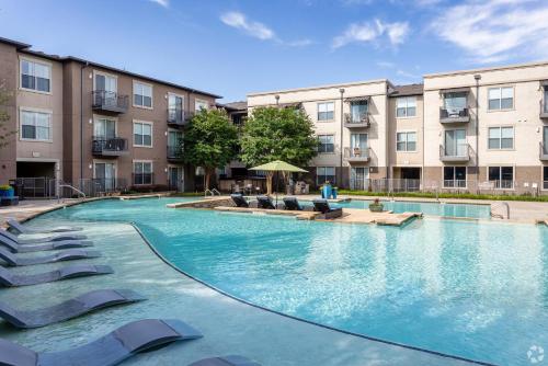 an image of a swimming pool at a apartment complex at Landing Spectacular 1BD Clubhouse Gym in Charlotte