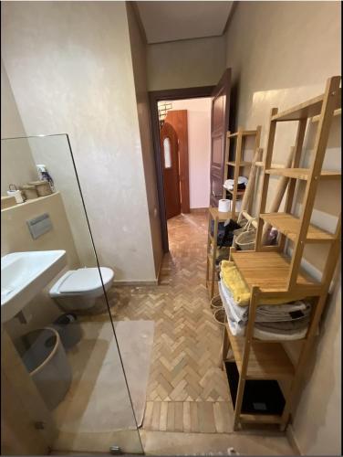a bathroom with a sink and a toilet and a mirror at VILLA DETENTE PISCINE PRIVEE PROCHE D'AGADlR in Taroudant
