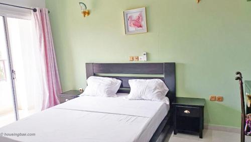 Llit o llits en una habitació de Résidence Inspire