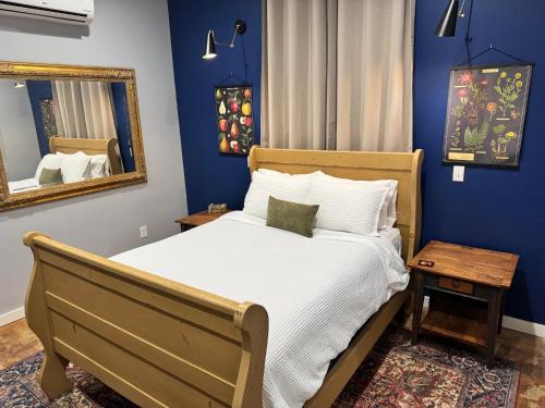 a bedroom with a bed and a mirror at Yellowstone Hideaway in Livingston