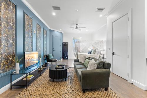a living room with a couch and a bed at Casa Ybor Apartments on 7th Ave in Tampa
