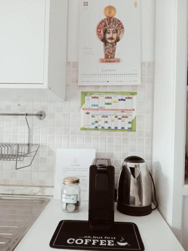 a kitchen counter with a coffee maker and a toaster at Primo Piano in Enna