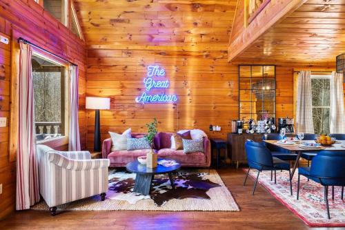 a living room filled with furniture and a table at 15 min Dollywood, Game room, Hot tub, Shared pool, Pets Welcome in Pigeon Forge
