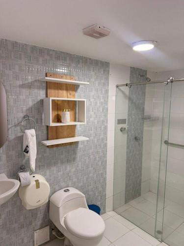 a bathroom with a shower and a toilet and a sink at Mosaico Cartagena Hotel in Cartagena de Indias