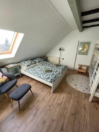 a bedroom with a bed and two bunk beds at Apartmány Malý Princ in Horní Blatná